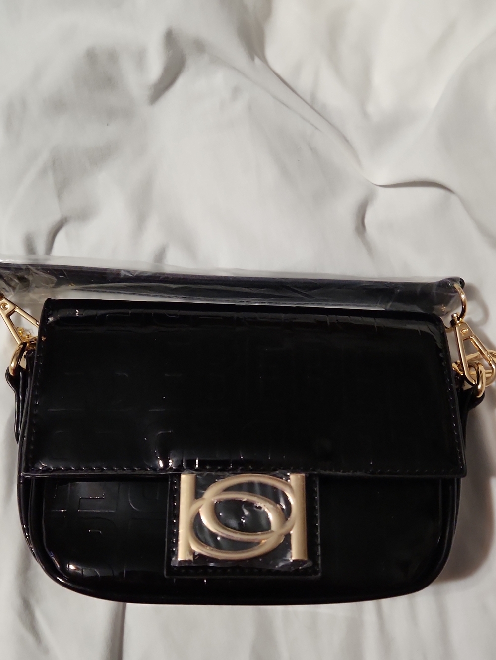 Bebe Black Patent Crossbody Bag with Gold Hardware